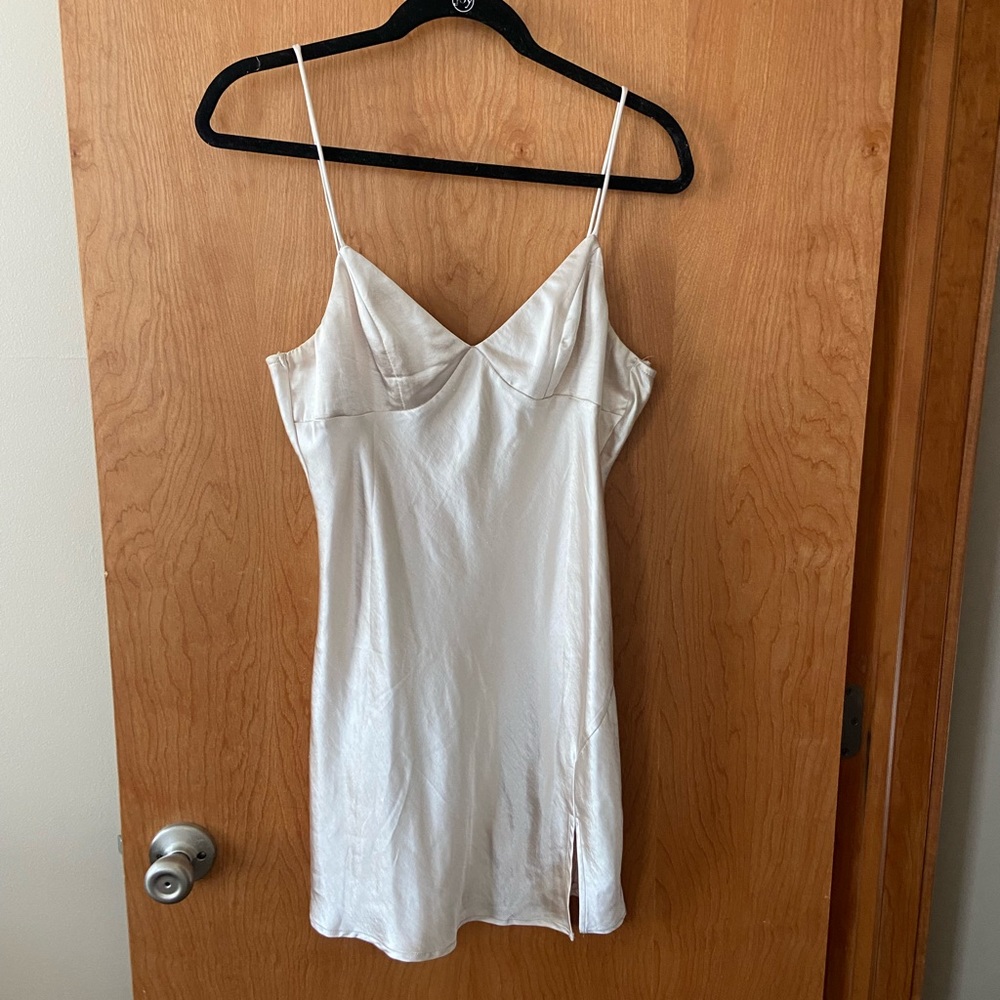 White satin slip dress with adjustable straps and tie back